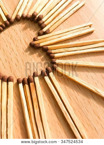 Wooden Safety Matches On A Wooden Background Arranged In The Shape Of A Heart. Matchsticks In The Sh