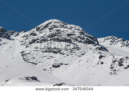 Natural Monument El Morado, Central Andes Of Chile. A Snowy Mountain Slopes