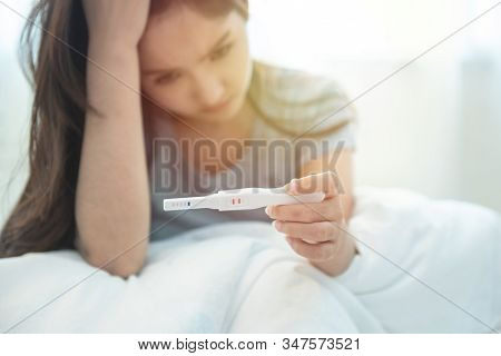 Selective Focus On Tester.unwanted Maternity Pregnant Asian Girl With Pregnancy Test In Hand.asian L