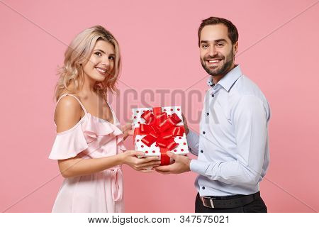 Beautiful Young Couple Two Guy Girl In Party Outfit Celebrating Posing Isolated On Pastel Pink Backg