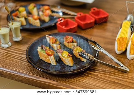 Meat Appetizers On French Loaf, With Tomato And Lettuce.