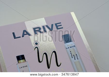 La Rive In Woman Deodorant And Perfume Bottles In Brand Box On Beige Background. La Rive S.a. Is One