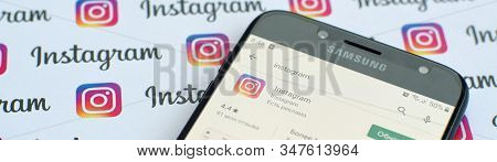 Instagram App On Samsung Smartphone Screen On Banner With Small Instagram Logos. Instagram Is Americ