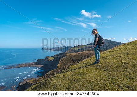 Deba, Gipuzkoa / Spain »; January 26, 2020: A Happy Young Woman Upstairs At The Sakoneta Geopark Vie