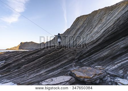 Deba, Gipuzkoa / Spain »; January 26, 2020: A Young Woman In The Sakoneta Coast Geopark One Morning