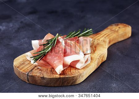 Dry Spanish Ham, Jamon Serrano, Bellota, Italian Prosciutto Crudo Or Parma Ham. Meat Cutting
