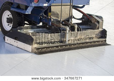 Special Machine For Cleaning Ice On An Ice Rink. Transport Industry. Street Ice Rink Service