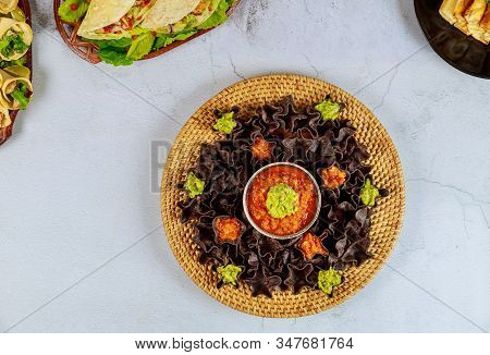 Tortilla Chips With Mild Salsa And Guacamole. Mexican Food.