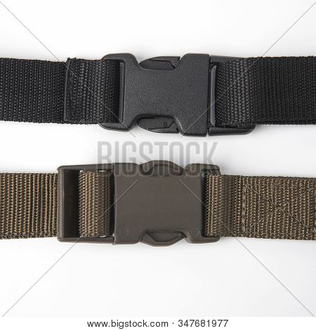 Black Plastic Fastex Clip For Backpacks On A White Background. Items Of Clothing And Equipment