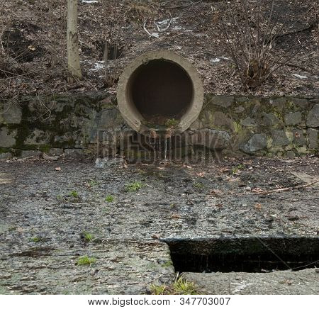 Concrete Run-off Pipe Discharging Water. Drain (drainage) Pipe.