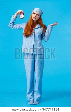 Why Didnt You Set Alarm. Confused And Unsure Upset Attractive Redhead Woman In Pyjama And Sleep Mask