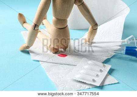 Composition With Anoscope On Light Blue Background. Hemorrhoid Treatment