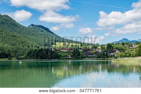 Weissensee Lake In The Bavarian Alps Near Fuessen, Allgaeu, Bavaria, Germany