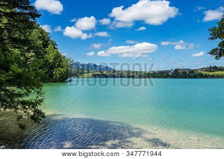 Weissensee Lake In The Bavarian Alps Near Fuessen, Allgaeu, Bavaria, Germany