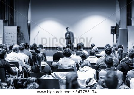Male Public Peaker Giving Presentation On Business Conference Event.