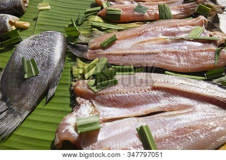 Set Of Sun Dried Gourami Fish On Banana Leaf / Salted Gourami Fish For Thai Food Preservation