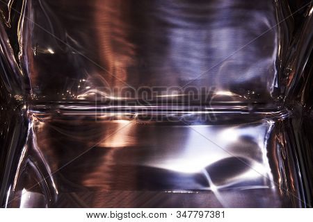 The Rib Between The Side Wall And The Bottom Of The Tank Is Stainless Steel. Reflections From Variou