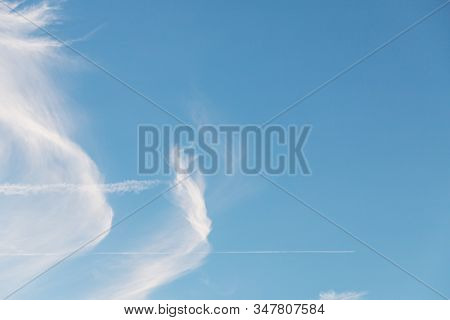 Blue Sky With Cirrocumulus Cloud Like A Wing. Beautiful Clear Sky Background