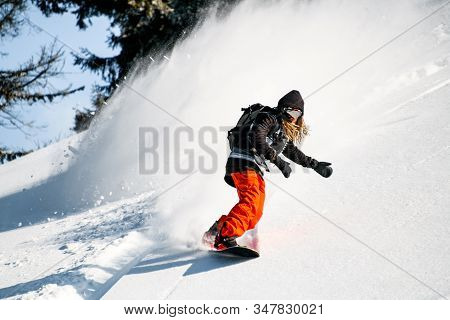 Guy With Dreadlocks Riding Down On The Mountain