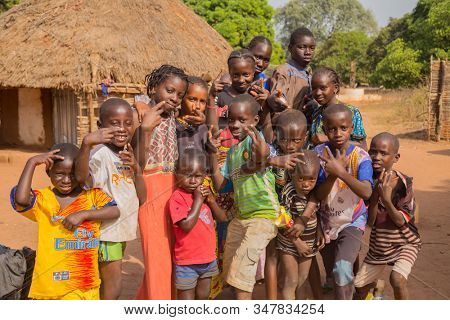 Bissau, Guinea-Bissau - January 5, 2020: group of African Kids looking at the camera in rural Guinea-Bissau