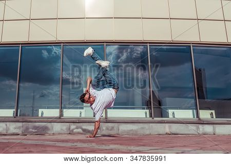 Man In Jump Stands On One Arm, Dancer Young Guy, In Summer In City, Dancing Street Dances, Modern St