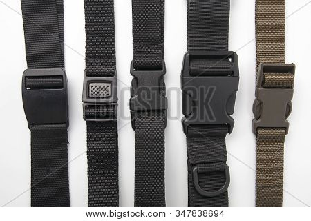 Black Plastic Fastex Clip For Backpacks On A White Background. Items Of Clothing And Equipment