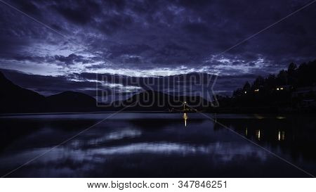 Blue Hour In The Dock Of Caleta Tortel. The Pacific Ocean Coast Can Be Appreciated. There Are Some F