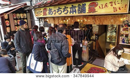 Osaka, Japan- 03 Dec, 2019: Customers Queuing In Front Of Takoyaki Octopus Balls Stall At Dotonburi 