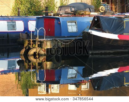 Old Narrow Boats And Barges Converted To Houseboats Moored In The Marina At Brighouse Basin In West 