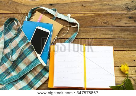 Notbook Monthly Planner, Mobile Phone For Business Work In Cloth Bag Of Lifestyle At Office Arrangem