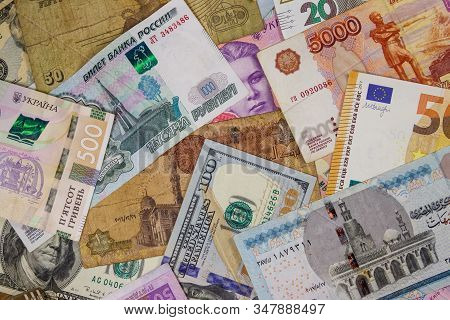 Multicurrency Background Of Euros Us Dollars, Russian Rubles, Egyptian Pounds And Ukrainian Hryvnias