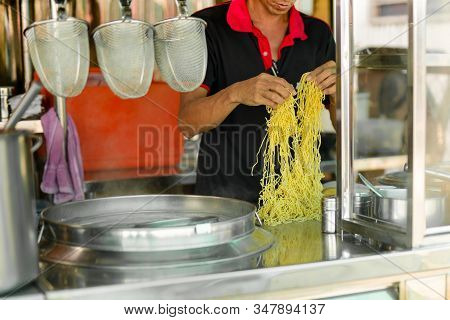 Mna Preparing Egg Noodles For Cooking Street Food Vendors.