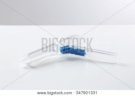 Medical Anoscope Isolated On White. Hemorrhoid Treatment