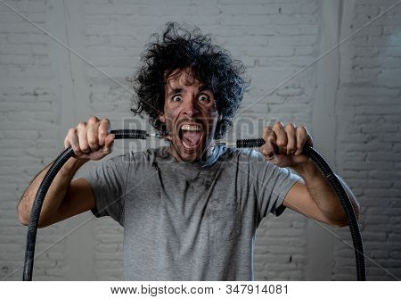 Funny Image Of Man Getting Electric Shock With Funny Face And Smoke All Around. Diy Concept