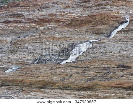 Scenic Waterfall Near Austerdalsvatnet Lake And European Svartisen Glacier In Nordland County In Nor
