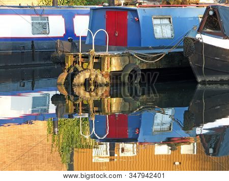 Old Narrow Boats And Barges Converted To Houseboats Moored In The Marina At Brighouse Basin In West 
