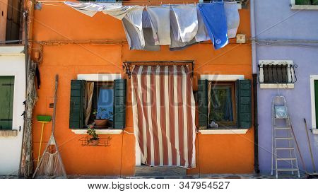 Shabby Orange House On Burano Island In Venice, Summer Tourism, Poverty Concept