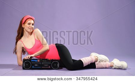 Girl Fitness Trainer Listens To Music After A Good Workout.