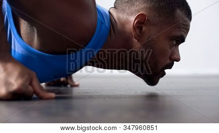 Muscular Athlete Warming Up In Gym, Doing Push-ups Before Contest, Career