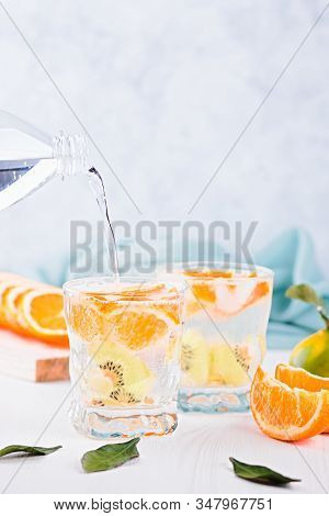 Summer Refreshing Non Alcoholic Cocktails With Orange And Kiwi Fruits Closeup Still Life. Summer Moc