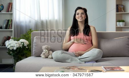 Inspired Pregnant Lady Stroking Tummy, Dreaming Of Soonest Appearance Of Newborn