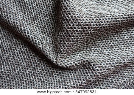 Draped Greyish Brown Woolen Fabric With Diamond Pattern