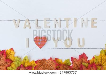 Love Day Concept. The Wooden Text Remain To Valentine's Day With Maple Leaf And White Background.val