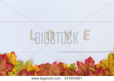 Love Day Concept. The Wooden Text Remain To Valentine's Day With Maple Leaf And White Background.val