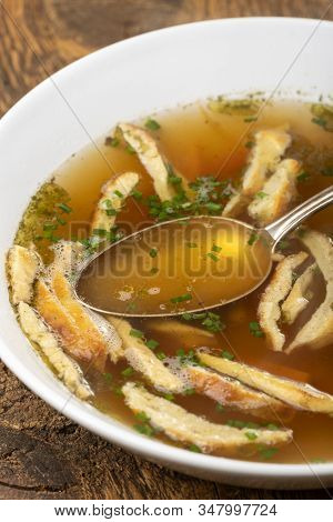 Overview Of A Bavarian Pancake Soup On Wood