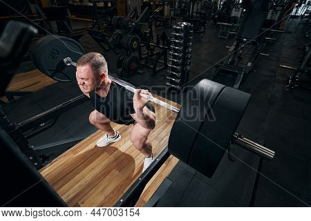 Strong Energetic Sportsperson Working Out In Fitness Room