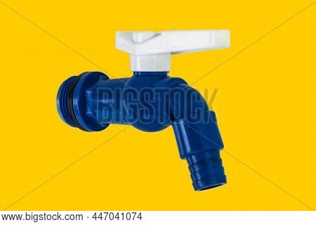 Blue Pvc Plastic Faucet On Yellow Background