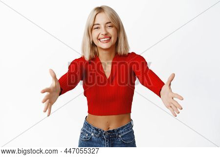 Portrait Of Attractive Female Model In Crop Top, Stretching Out Arms At Camera For Hug, Hugging, Emb