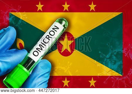 Grenada Outbreak Of Omicron Variant. A Hand In A Blue Rubber Glove Holds A Test Tube With Covid-19 V