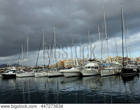 Yachts In A Small Picturesque Harbor On The Island Of Tenerife.